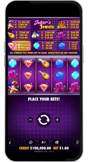 Jokers Jewels paytable screen showing all symbol values with five reels loaded and ready to spin